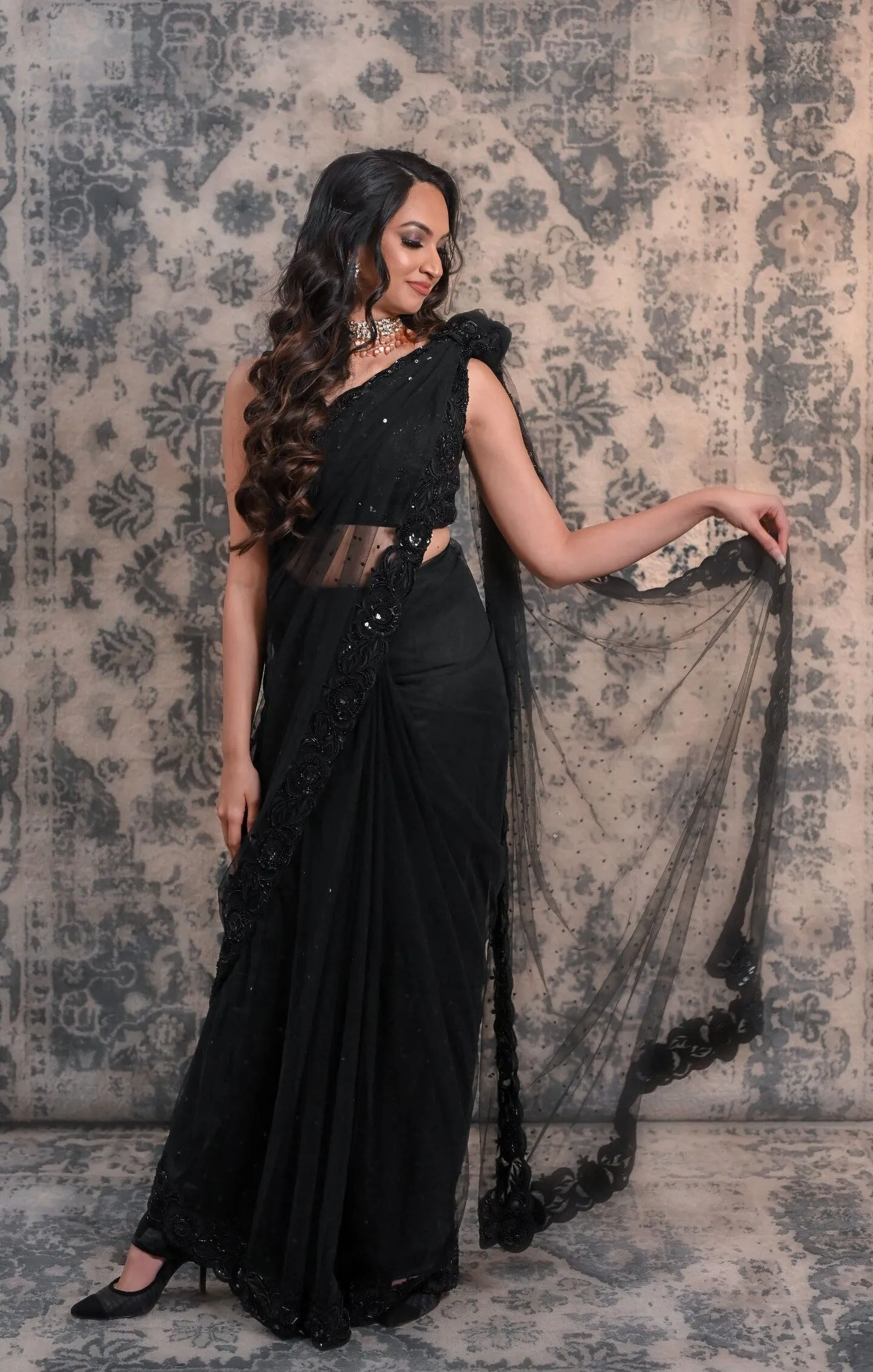Complete Your Wardrobe With This Black Colored Net Saree