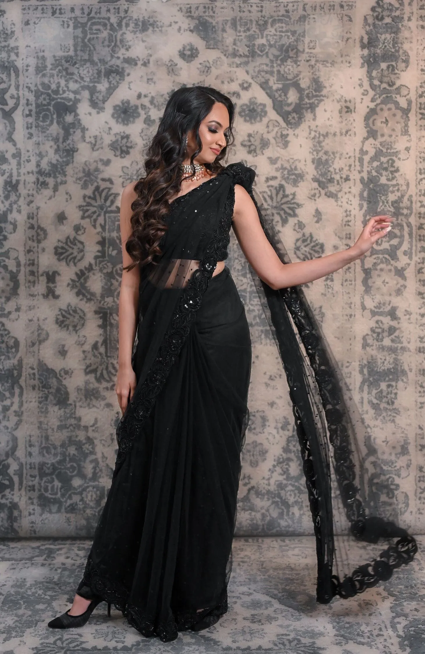 Complete Your Wardrobe With This Black Colored Net Saree