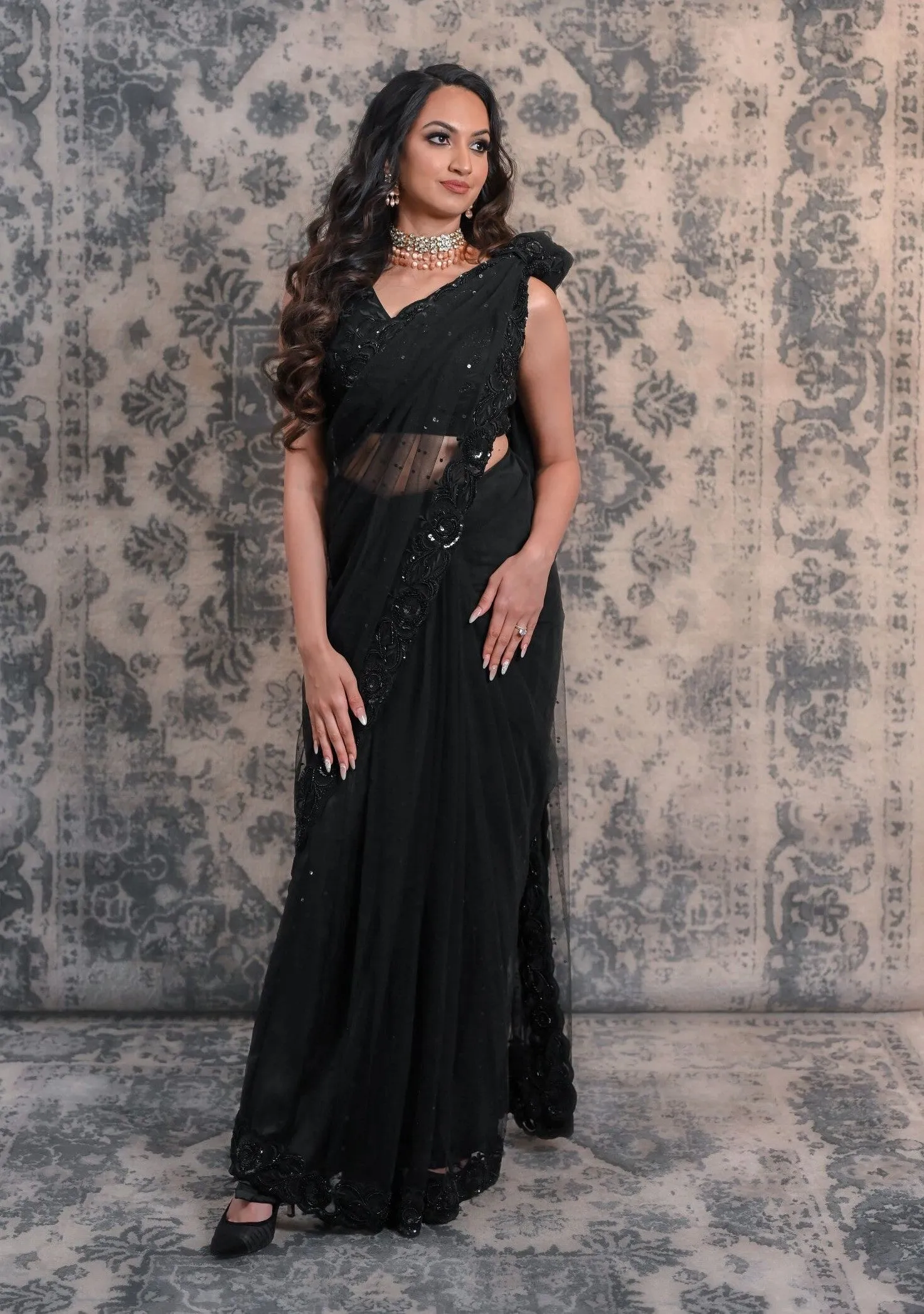Complete Your Wardrobe With This Black Colored Net Saree